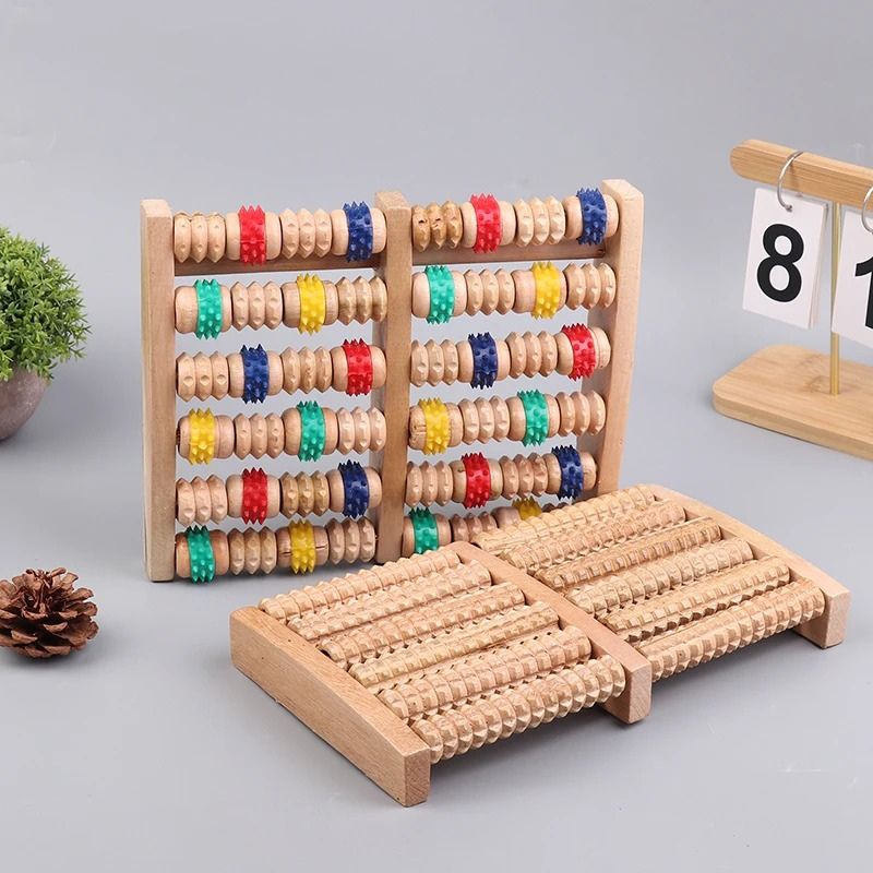 Présentation des deux variantes du plateau masseur Soulavi — version bois naturel et version rouleaux colorés