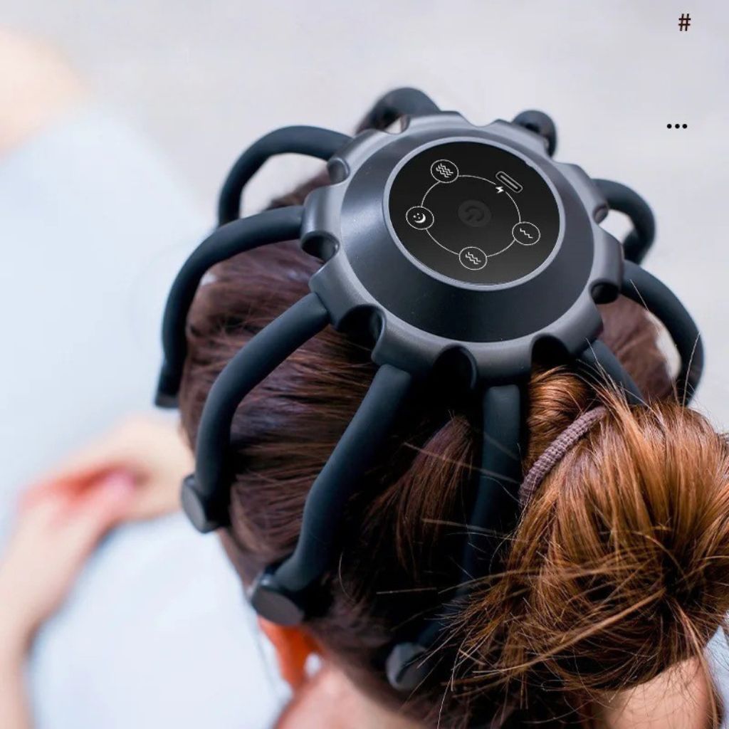 Vue de dessus du masseur de tête électrique Octopus, écran de contrôle avec icônes des modes de vibration visibles
